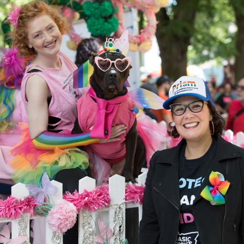 Chair Jessica Vega Pederson (right) with the Pitties in Pink float at the 2019 Pride Parade, featuring volunteer Molly (left) and canine ambassador Hamilton (center)