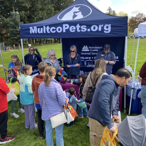 MCAS Outreach tent and volunteers at Wood Village Outreach Event