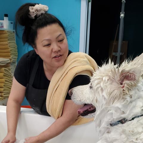 Dawb at Rub-a-Dub comforts Coco during his bath