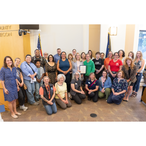 A group photo from the Foster a Pet Day Proclamation signing on June 17, 2026. Regional animal welfare organization representatives and their volunteer ambassadors join Multnomah County Commissioners.