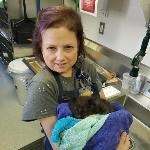 Jessica with a sleeping kitten